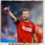 - High-quality, colorful painting of a man in a red jersey that combines a passion for soccer and art.